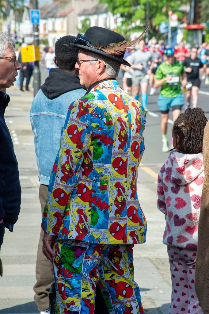 Runner in pink vest with pink goggles smiling