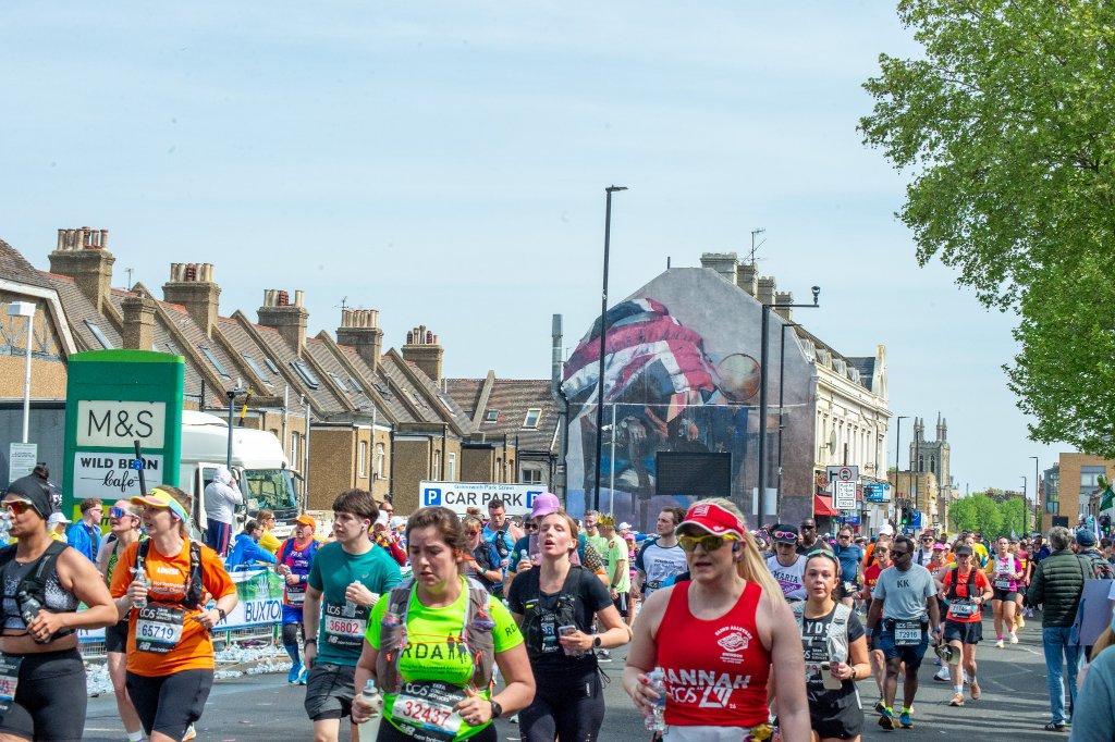 Runners with mural and London skyline