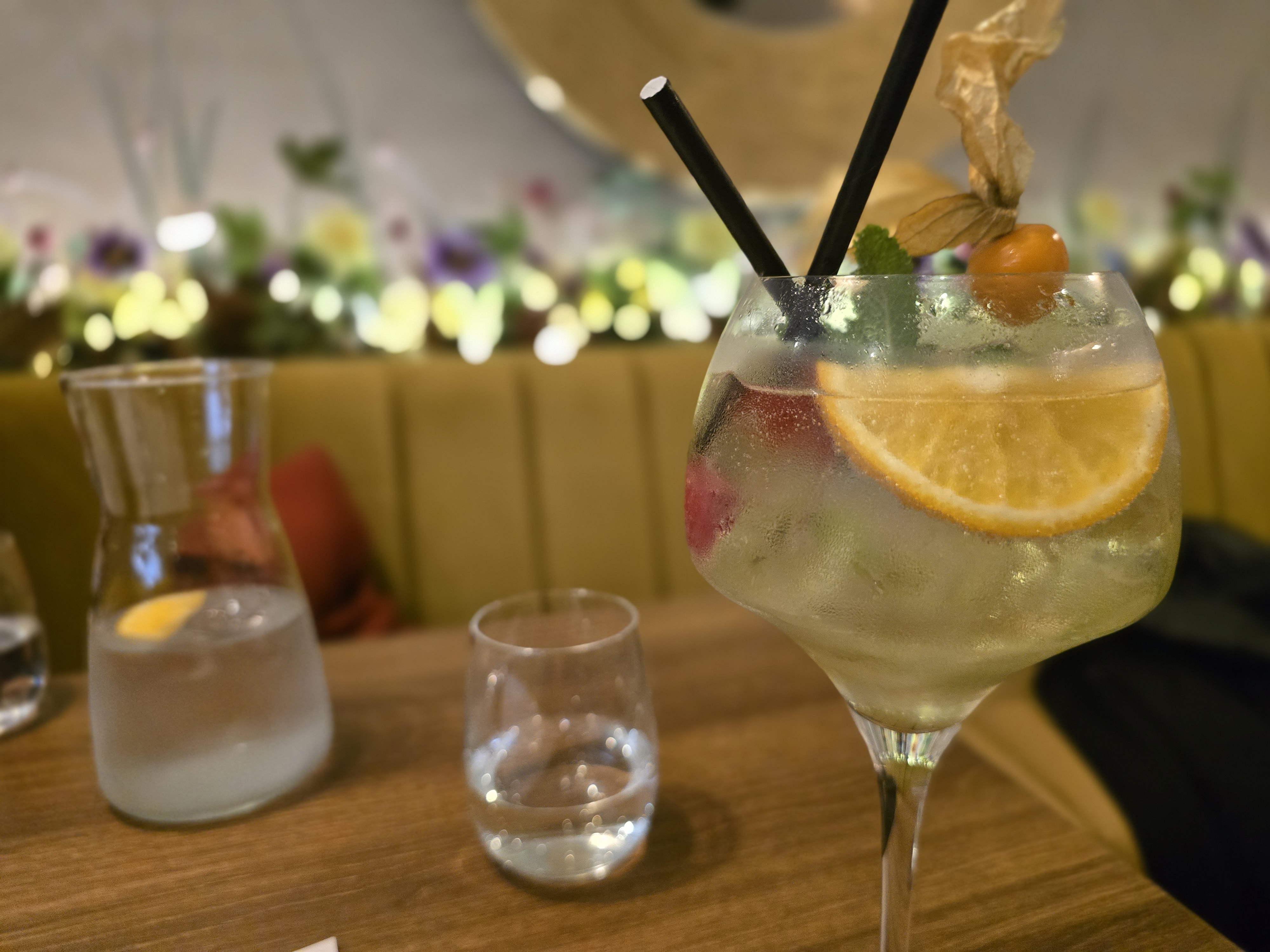 Cocktail with water carafe on the table