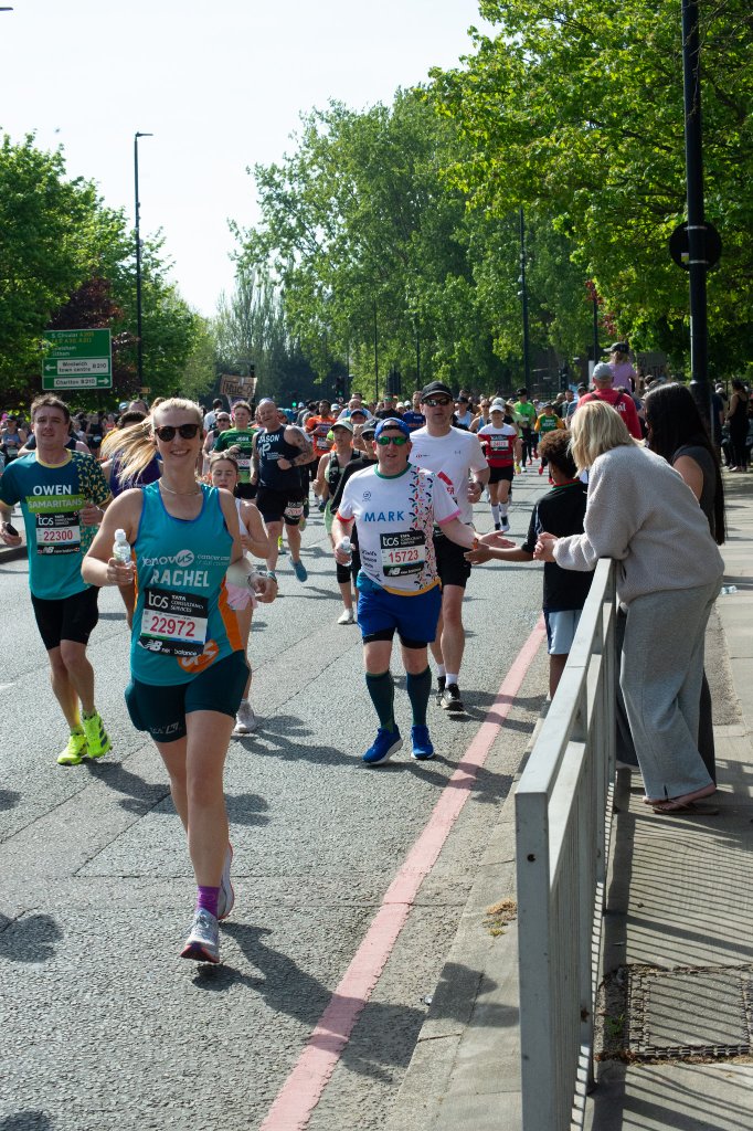 Runner with bib number 28833 pointing at camera