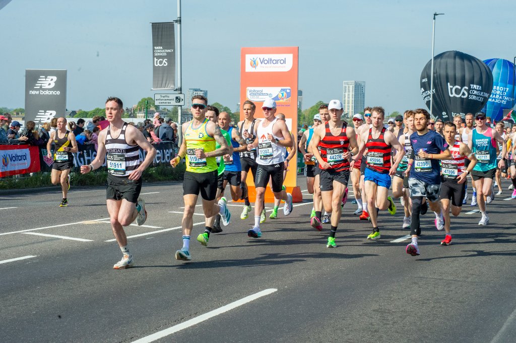Runners with Guide Dogs for the Blind vests
