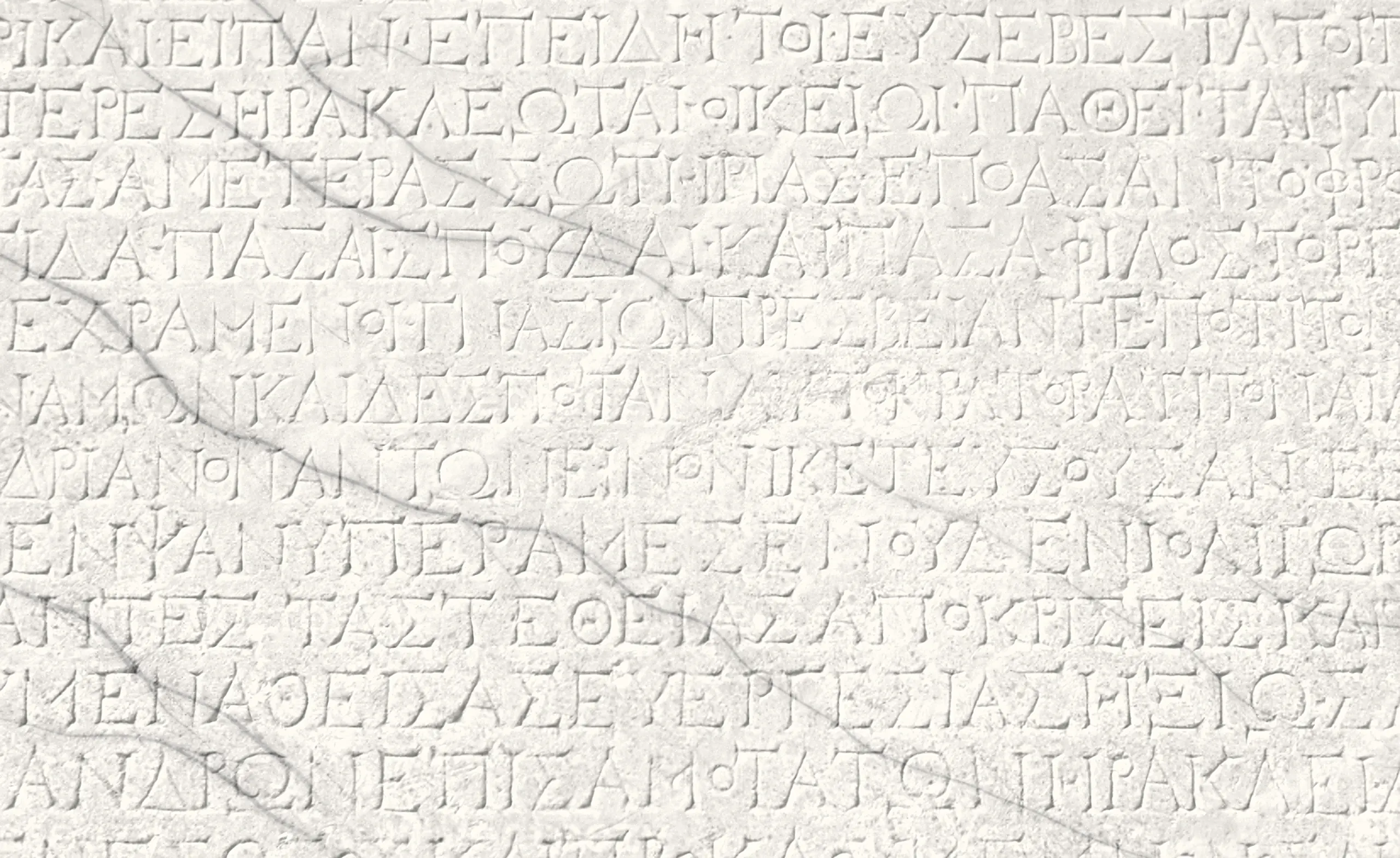 White marble slab carved with an ancient Greek inscription