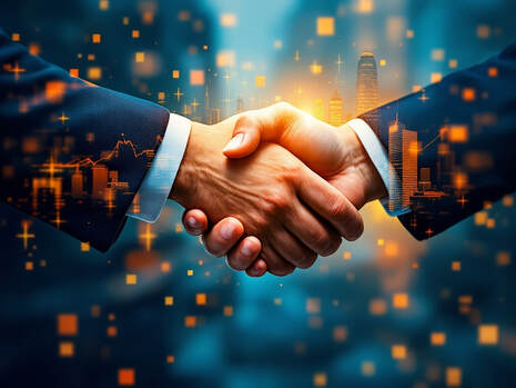 A business handshake — collaboration and partnership