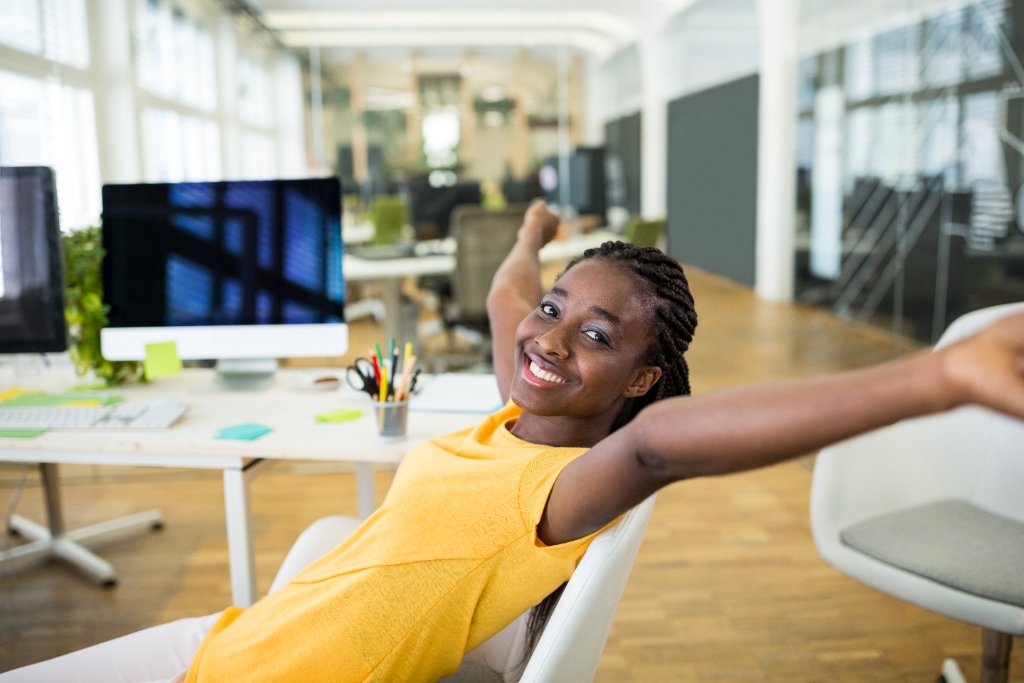 African professional in a bright office, illustrating the African coverage gap between Deel and Kernel