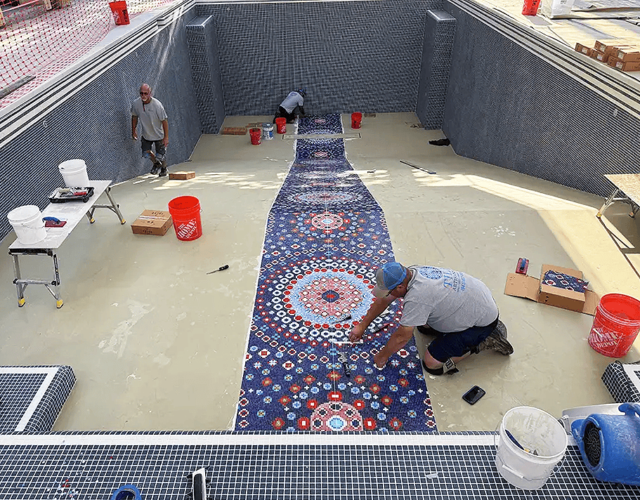 Hand-finished glass mosaic surface showing material movement and precise spacing