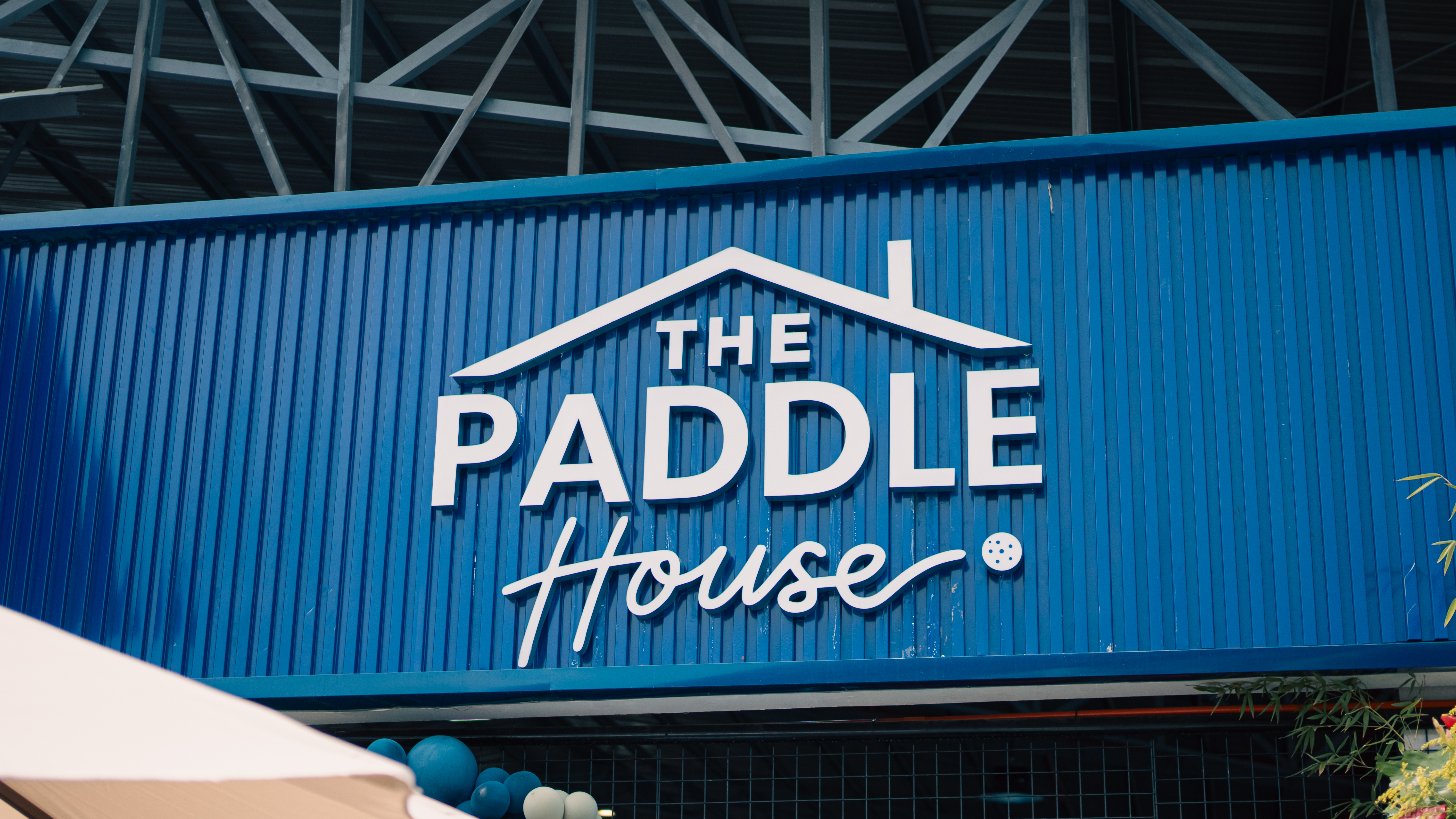 The Paddle House signage