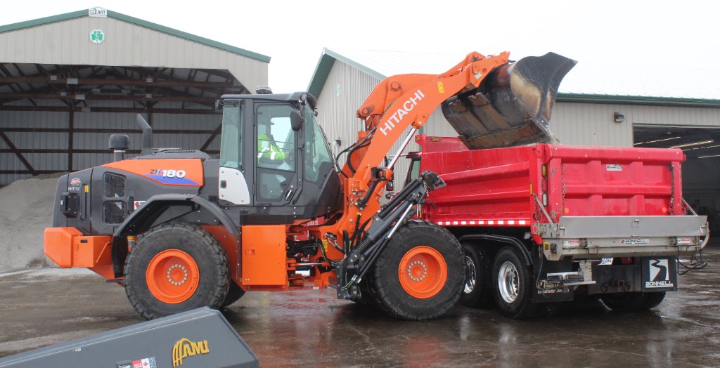 Hitachi wheel loader filling dump truck