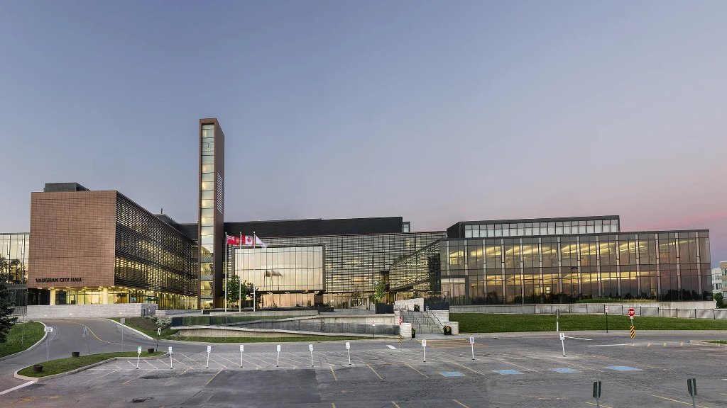 Vaughan City Hall with clock tower at dusk