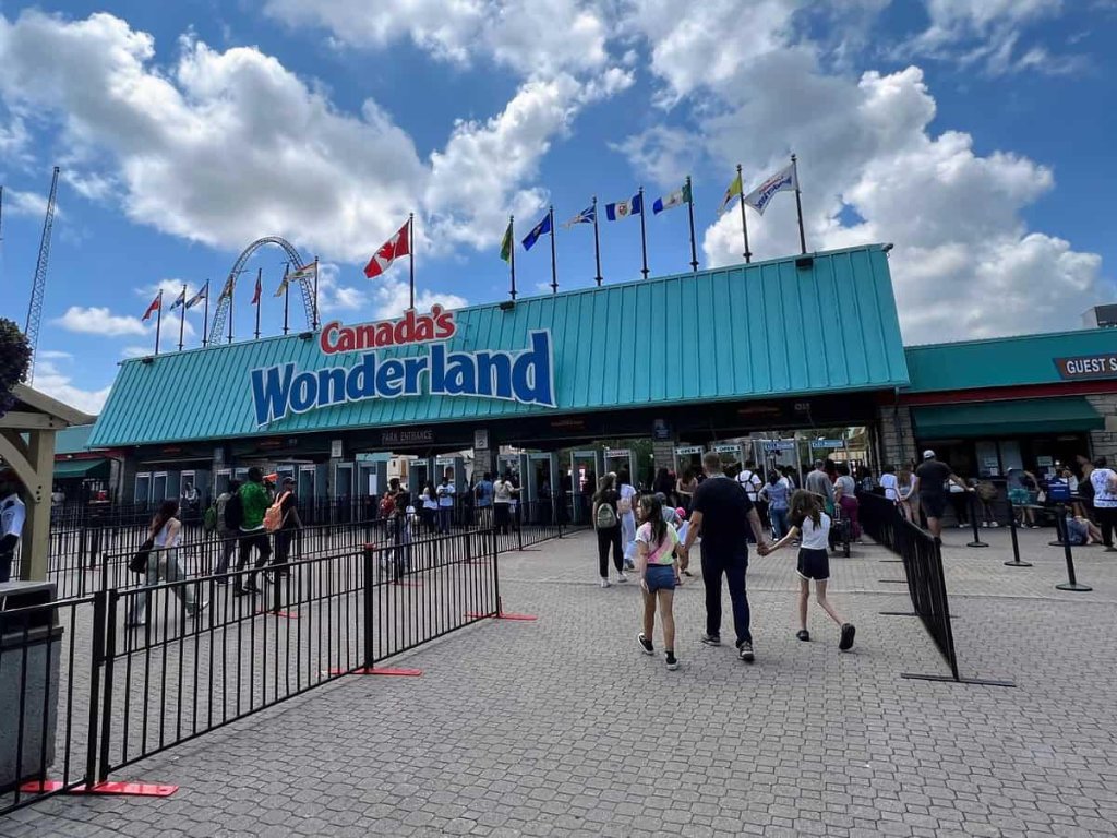 Canada's Wonderland entrance gate with flags and roller coaster