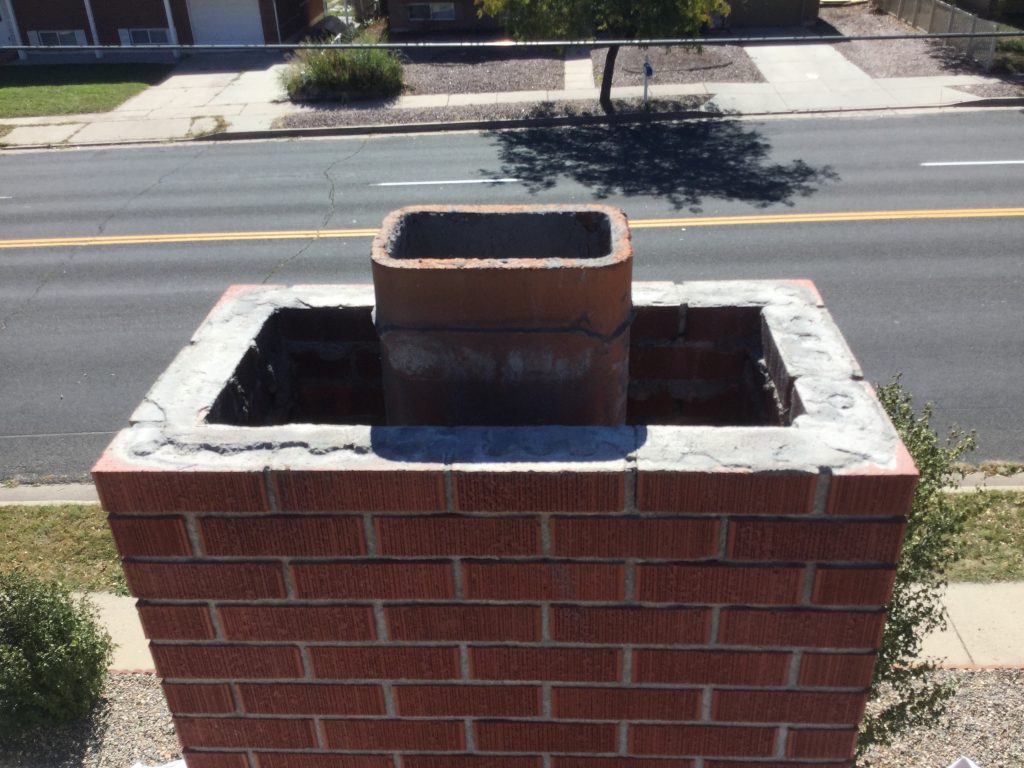 Damaged chimney crown before repair