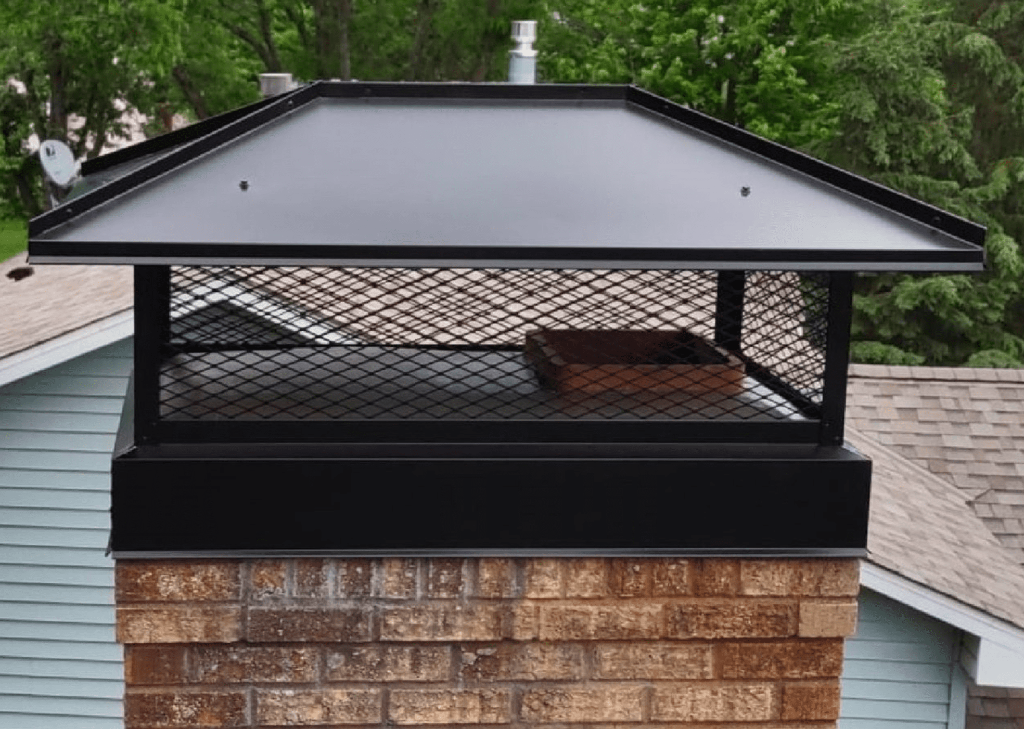 New stainless steel chimney caps installed after replacement