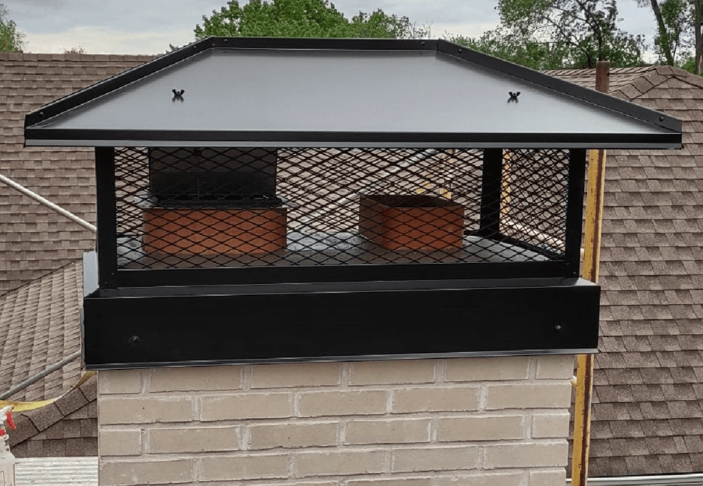 Restored chimney masonry with new caps after professional repair