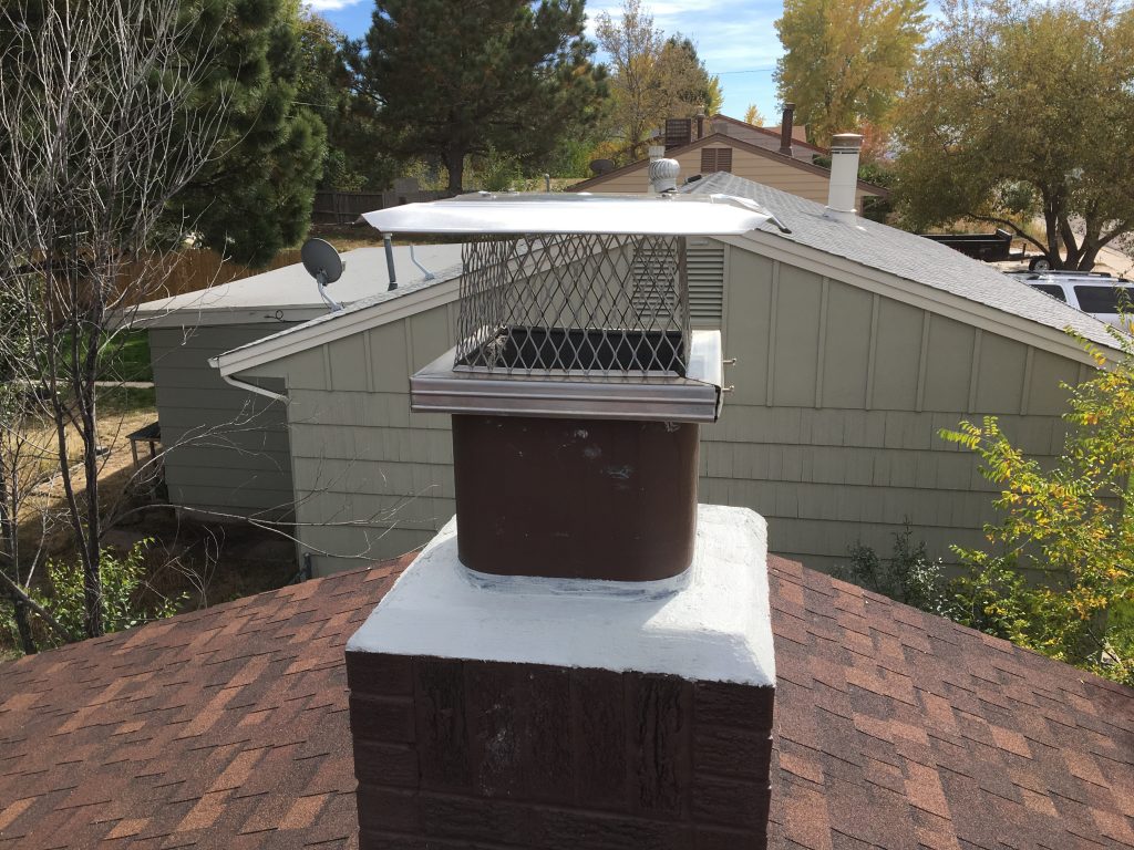 Repaired chimney with new stainless steel cap installed