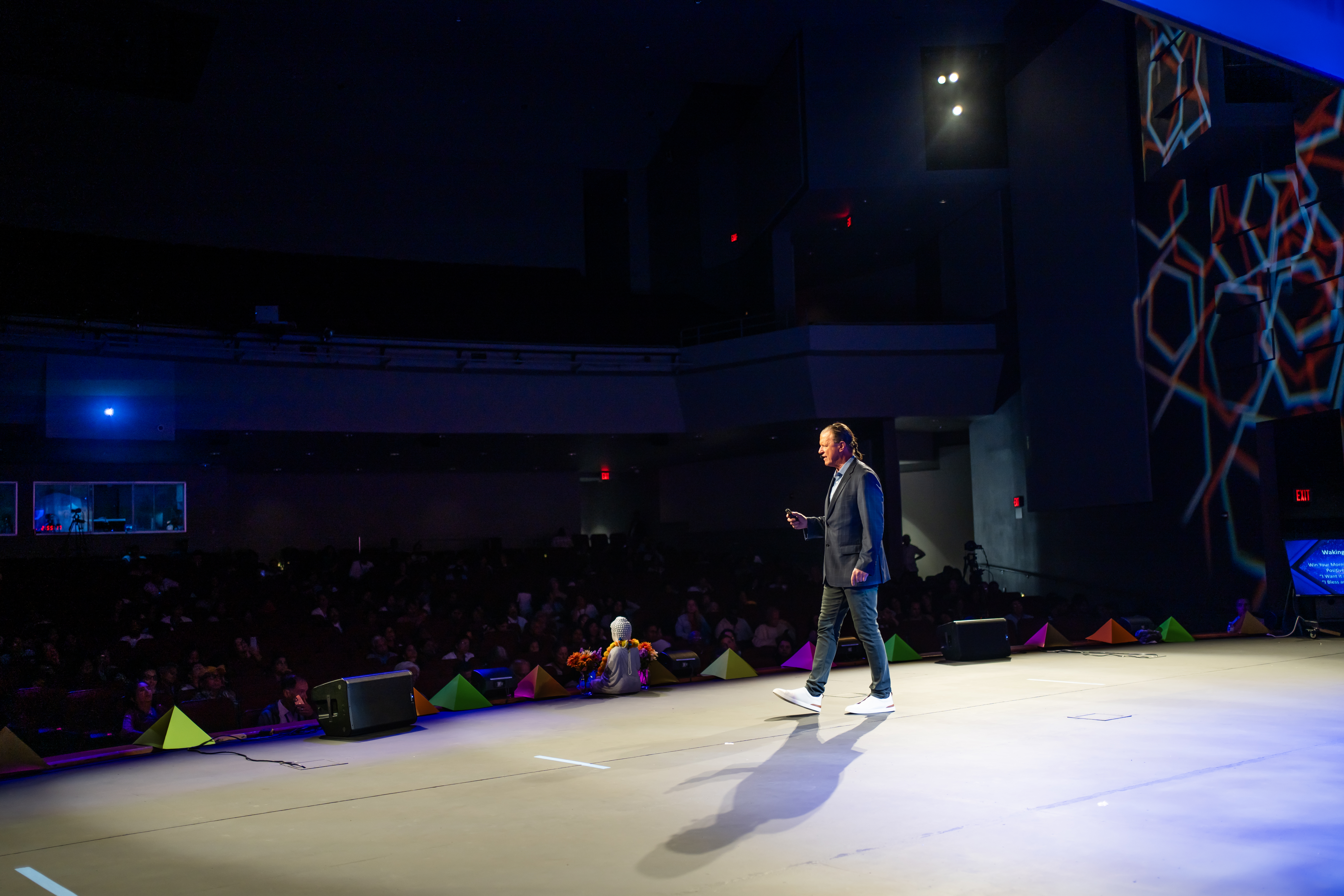 Papi (PJ) DiNuzzo speaking on stage to a live audience