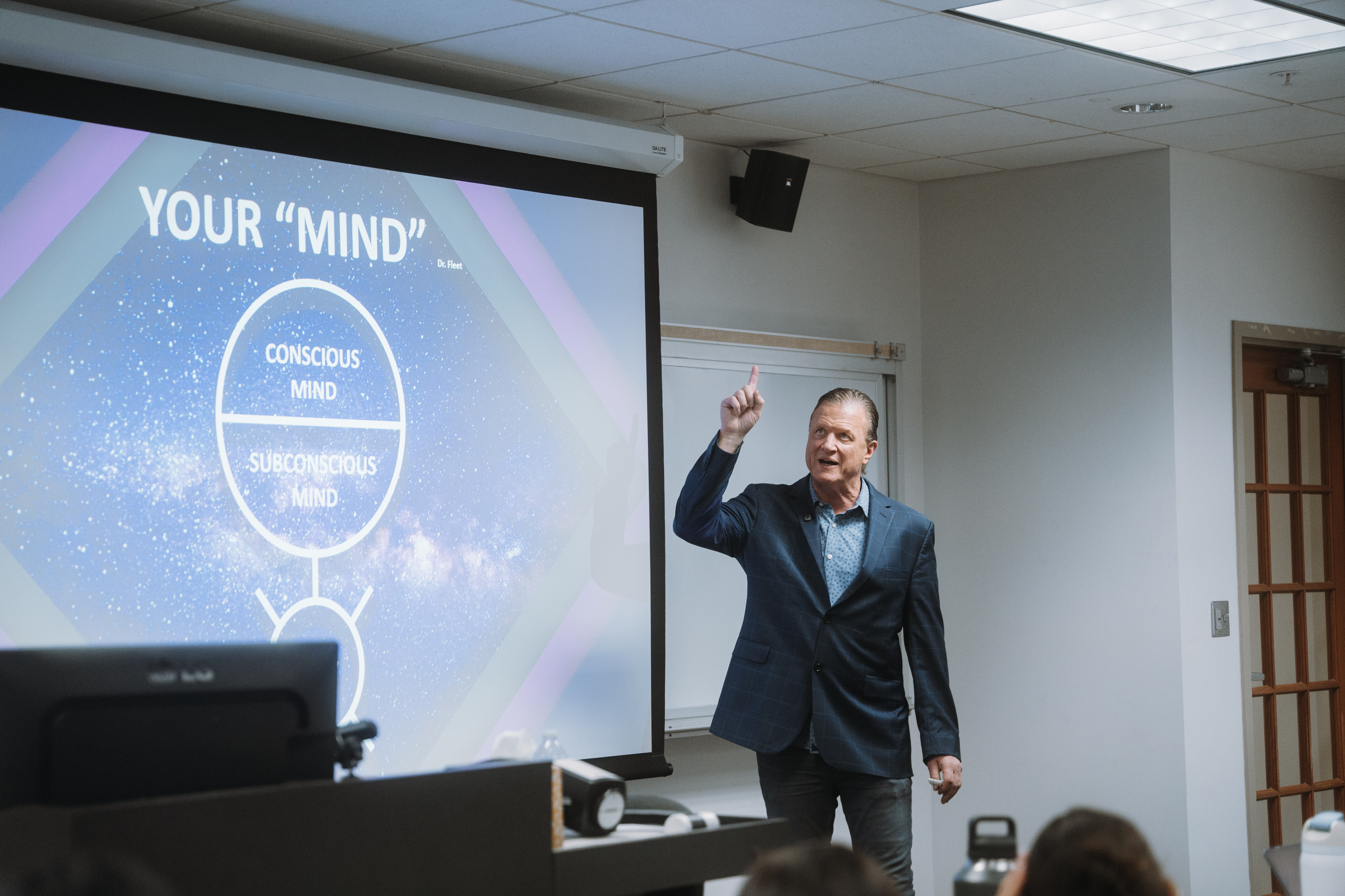 Papi(PJ) DiNuzzo teaching mindset principles during a group coaching session