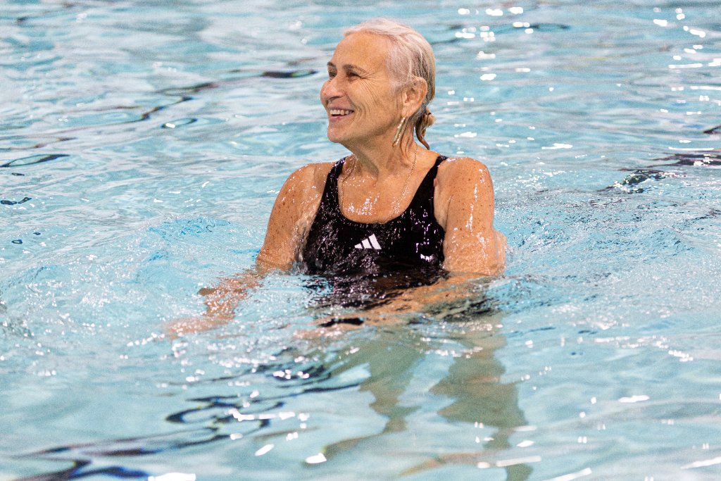 Older adult happy in pool