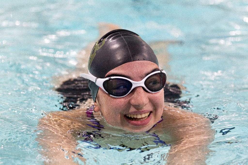 Adult swimmer smiling after lesson