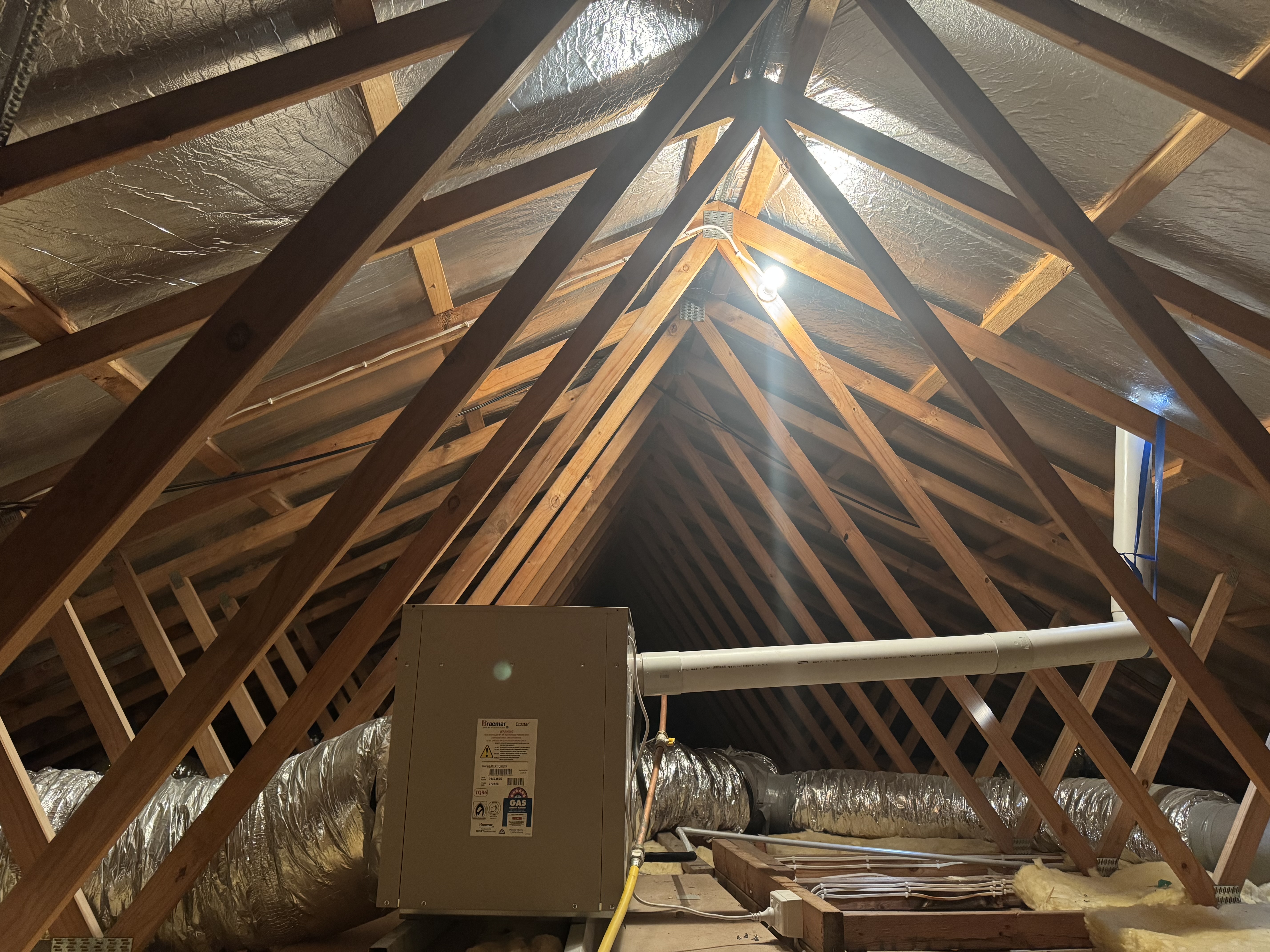 Ducted gas heater and insulated ductwork installed in a roof space