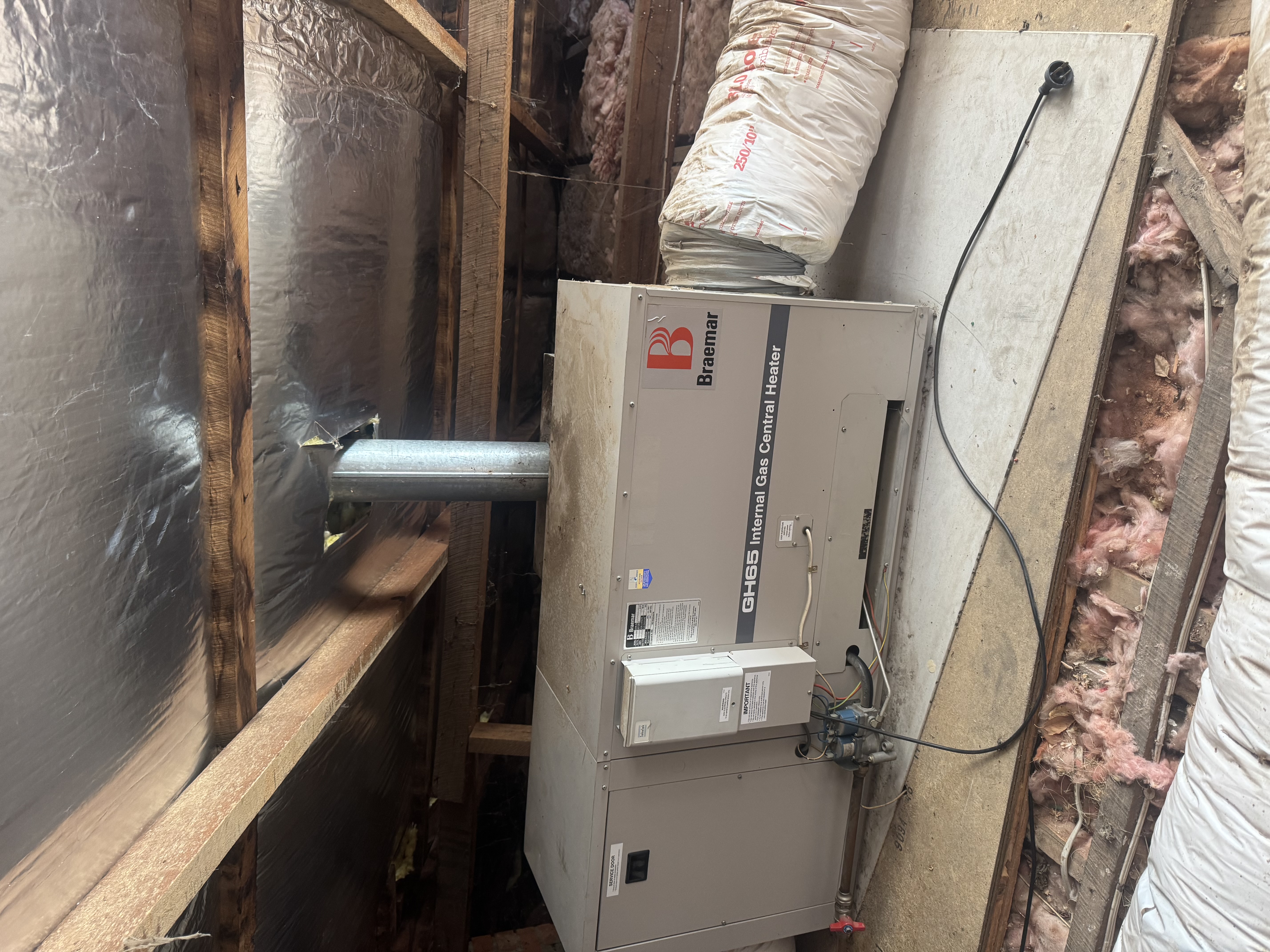 Braemar GH65 internal gas central heater in a roof space