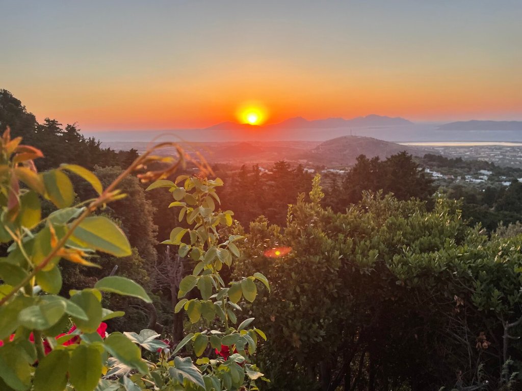 Sunset view over the Aegean Sea from a traditional taverna terrace in Zia Village, Kos