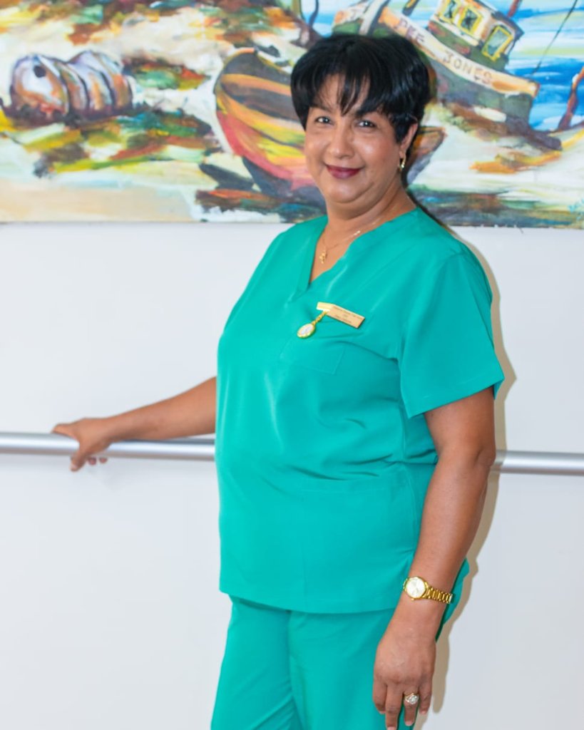 Three care staff members smiling