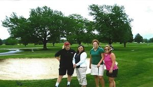 Four players on the course at a golf tournament
