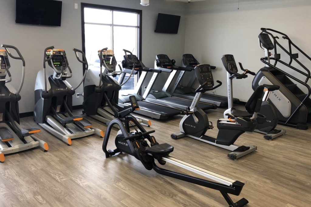 Cardio row with Matrix ellipticals and treadmills at Hometown Fitness