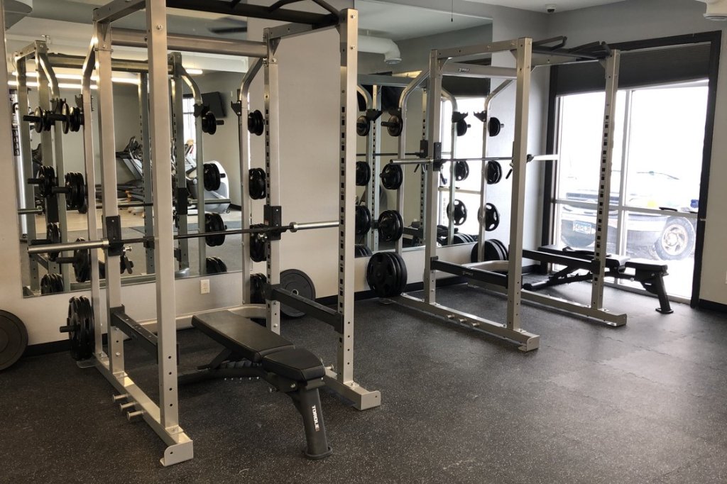 Torque power racks with full mirror wall at Hometown Fitness