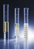 Three test cylinders showing demulsified, partial emulsion, and fully emulsified oil-water samples