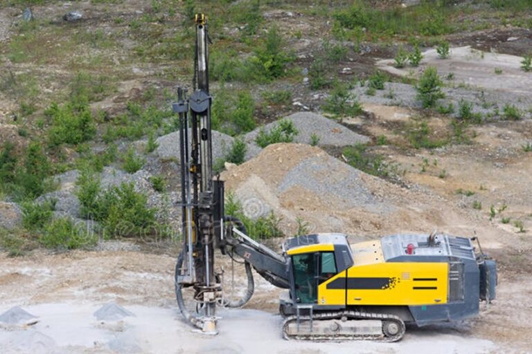 Rock drill lubrication - mining drill rig