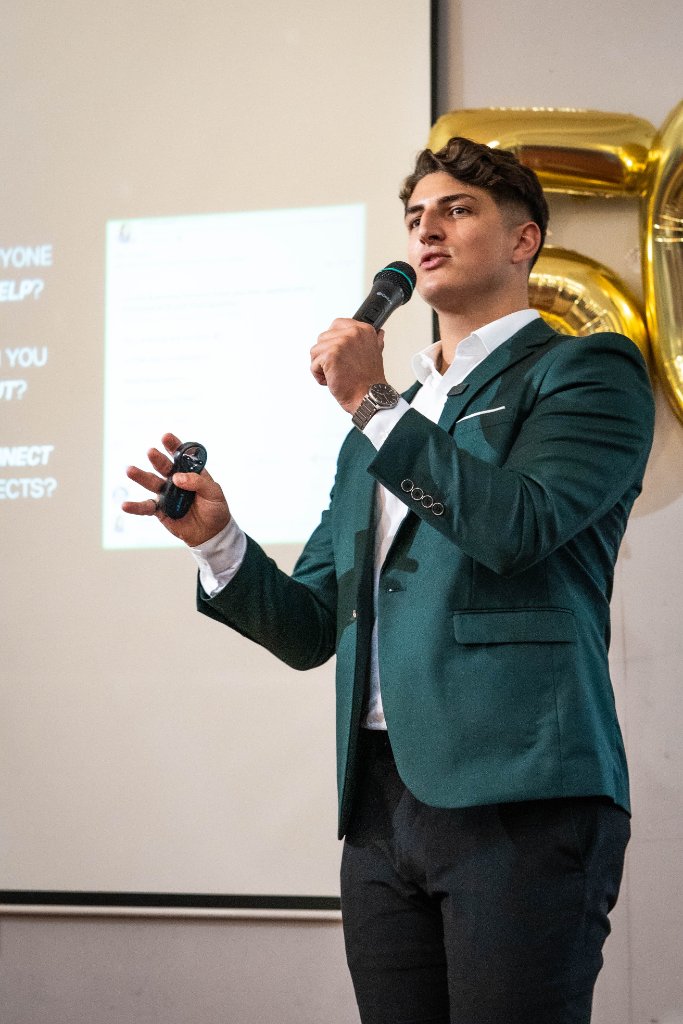 Elliot Ghali delivering a marketing keynote on stage at a South Yorkshire business conference