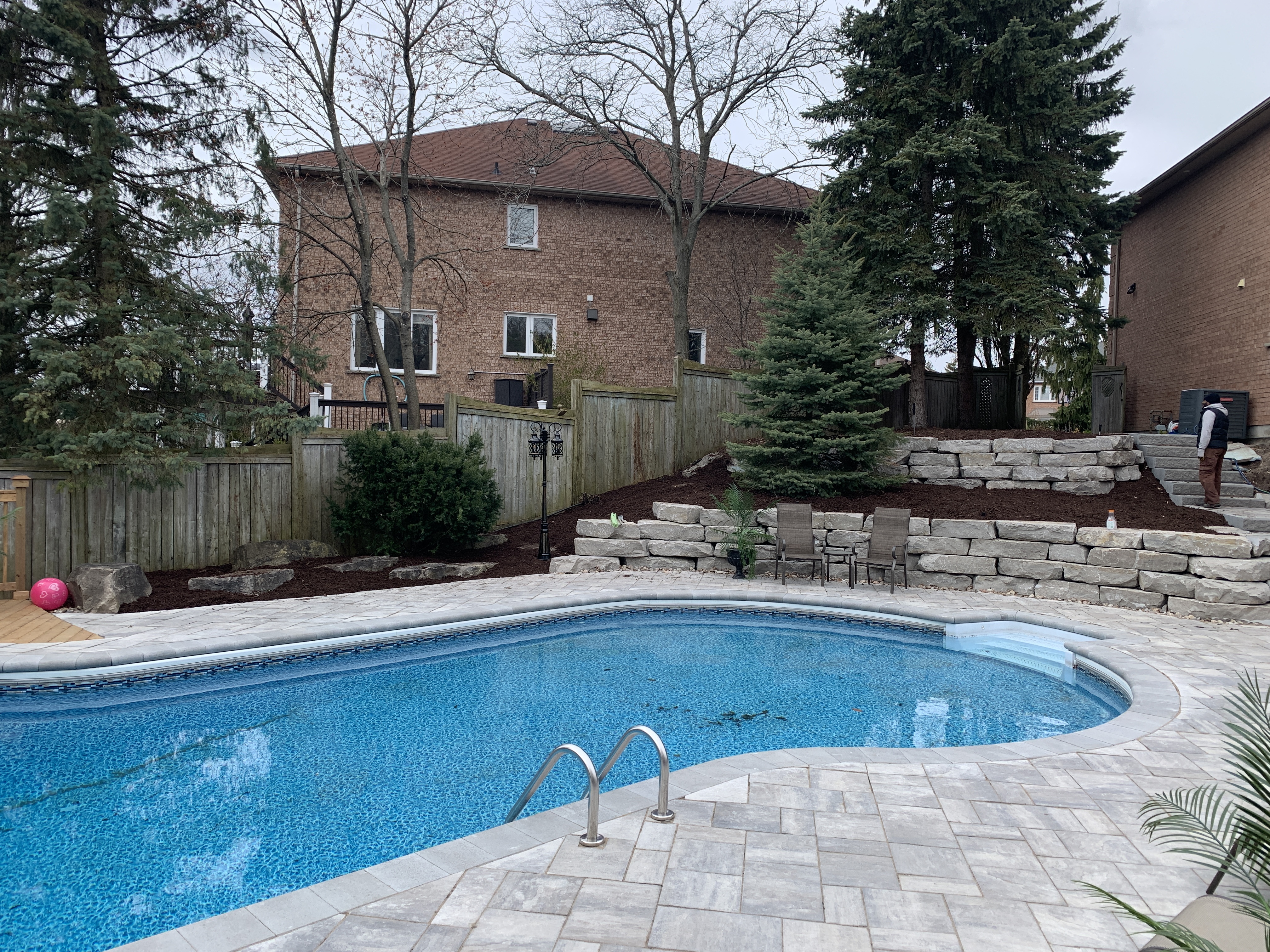 Inground pool surround with fresh sod installed by Michael Durham Landscaping in Durham Region, Ontario