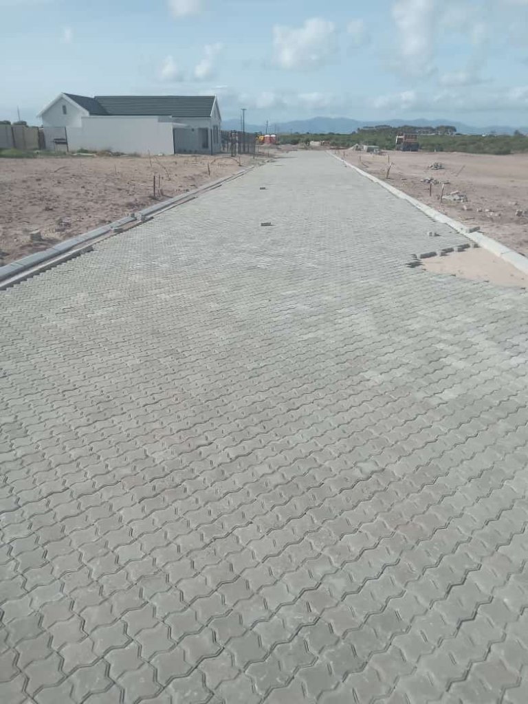 Wide paved road with concrete blocks