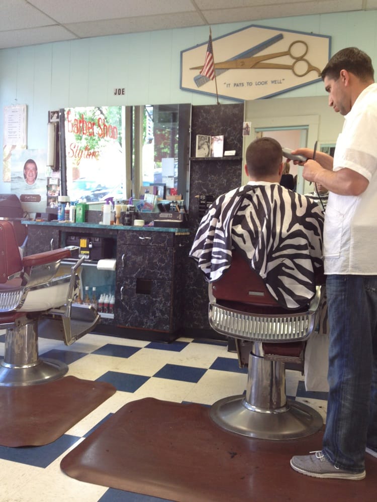 Barber chair and styling station inside Joe's Barber Shop in Newtonville MA