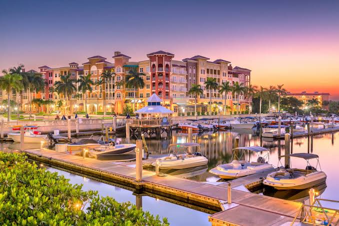 Luxury waterfront community at sunset, Naples