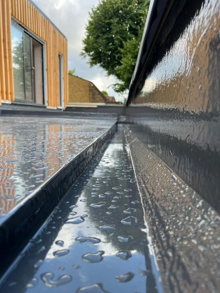 MonoSeal flat roof gutter detail — polyurea membrane detailing