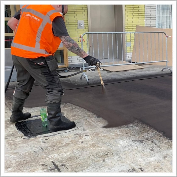 SprayGrade applied to concrete parking deck — seamless spray waterproofing