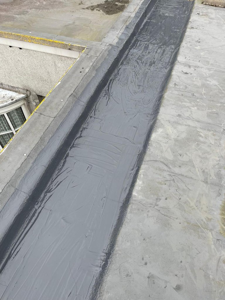 Repair sealant applied to residential roof surface