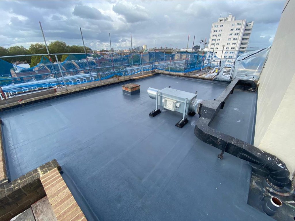 Rocathaan HotSpray flat roof with upstands — polyurea spray membrane