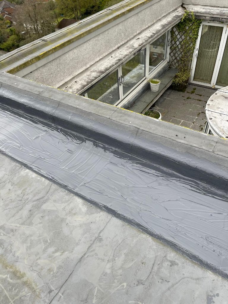 Repair sealant applied to roof edge detail