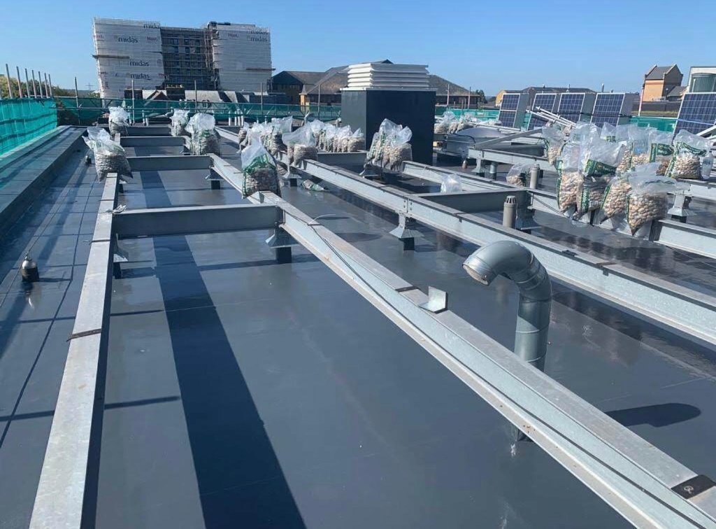 Rocathaan HotSpray commercial roof close-up — spray polyurea membrane
