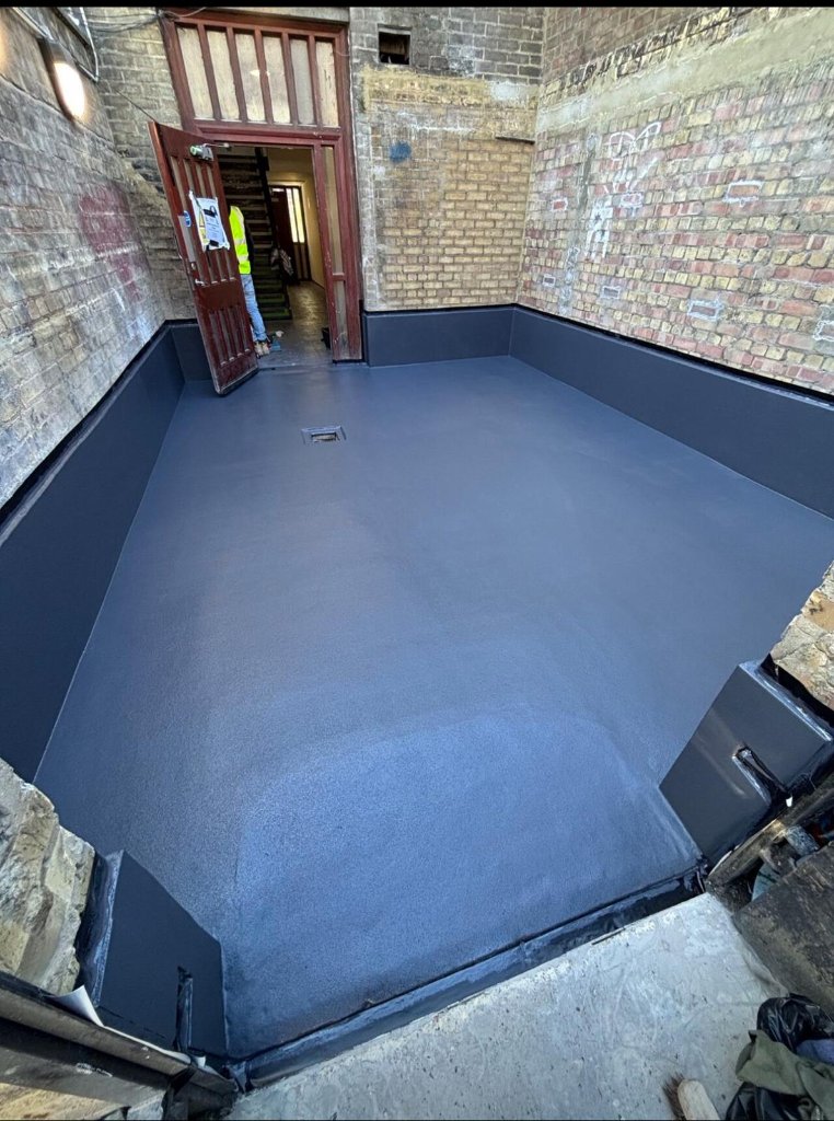Rocathaan HotSpray roofing application — heated plural-component spray system