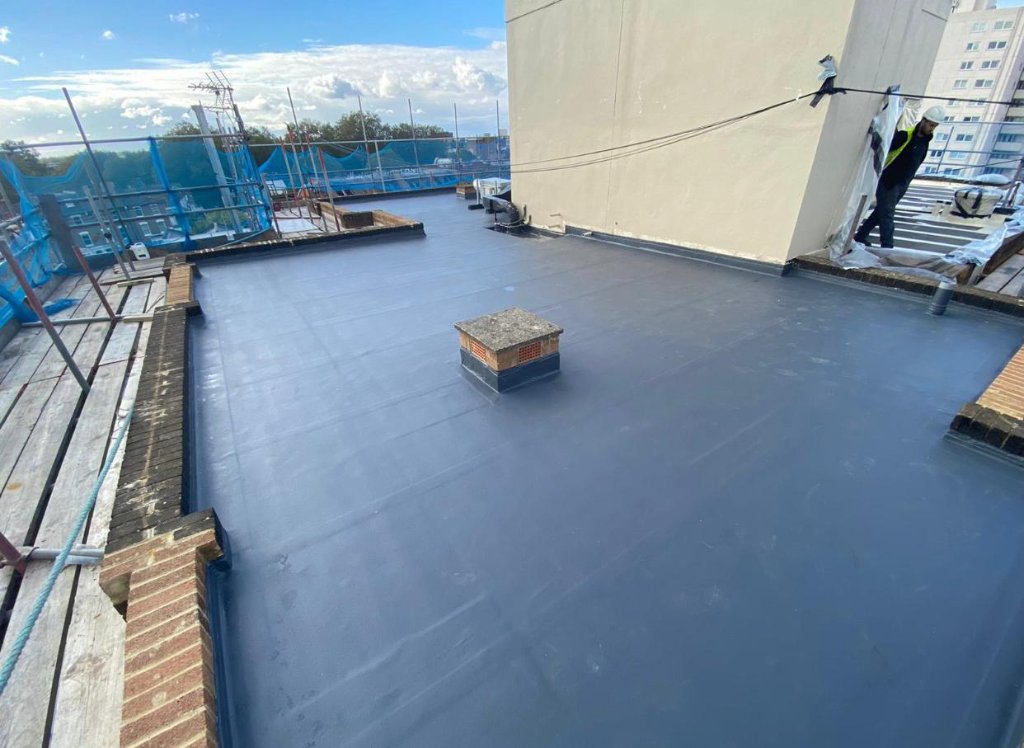 Rocathaan HotSpray multi-bay roof — large-scale spray-applied waterproofing