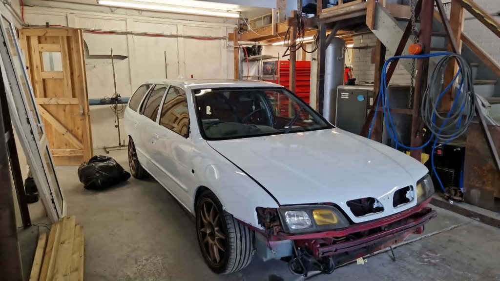 White estate full vehicle respray in professional spray booth — M&M Vehicle Repairs Tewkesbury