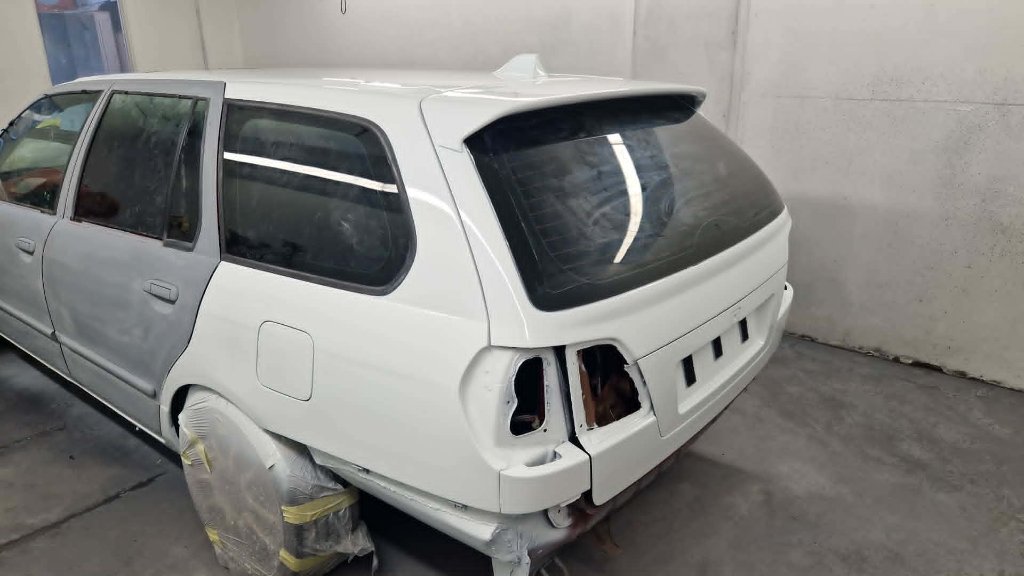 Estate car primed white in spray booth at M&M Vehicle Repairs Tewkesbury