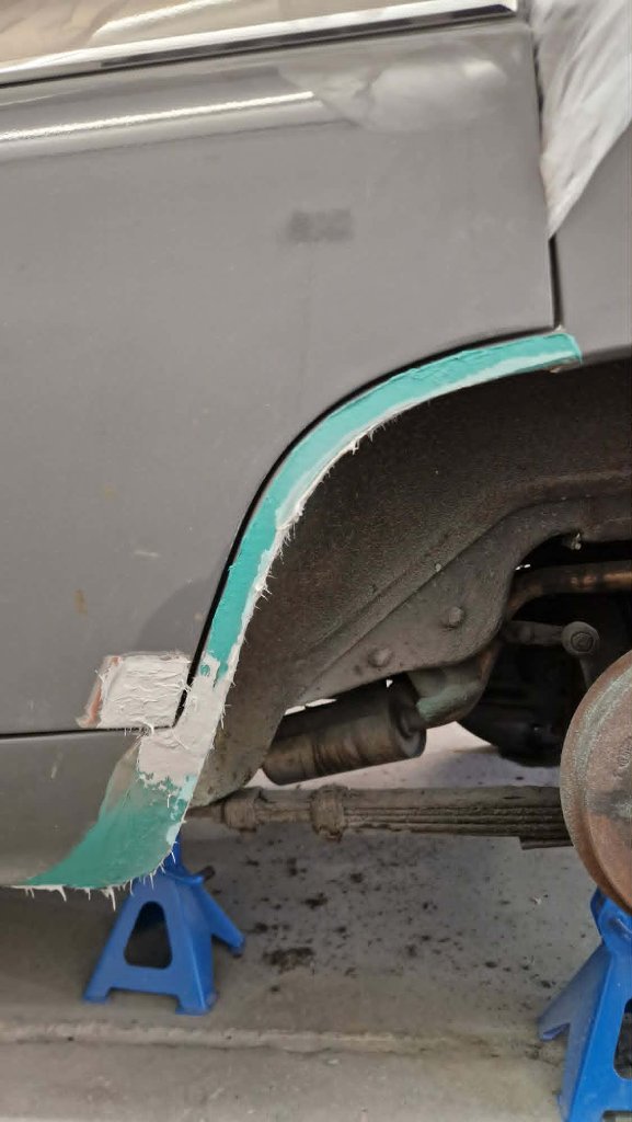 Front bumper and bonnet primed on spray stand — Tewkesbury workshop