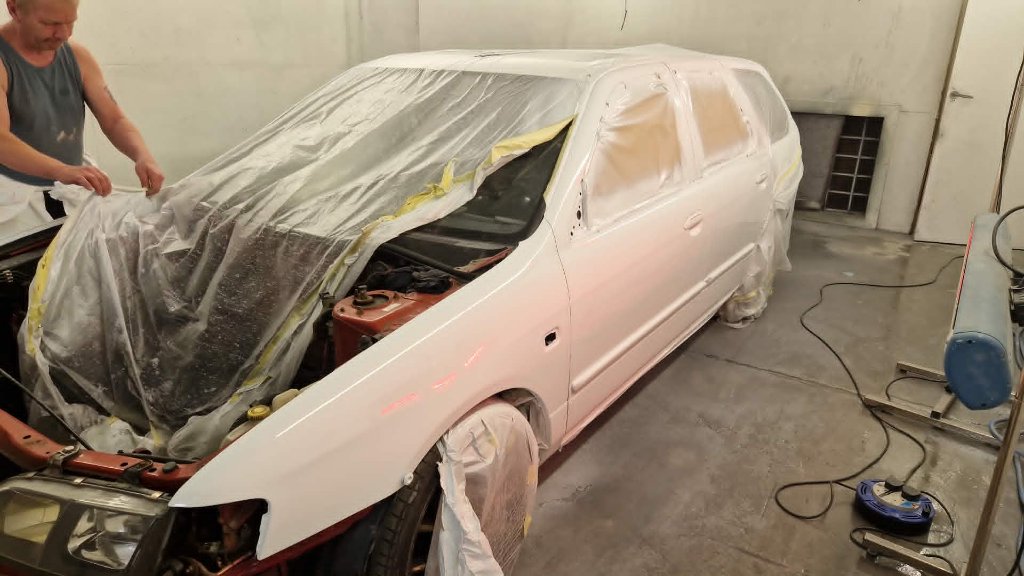 Estate car masked up in spray booth during full vehicle respray — M&M Vehicle Repairs Tewkesbury