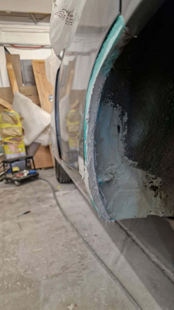 Estate car primer stage in spray booth — Tewkesbury bodyshop