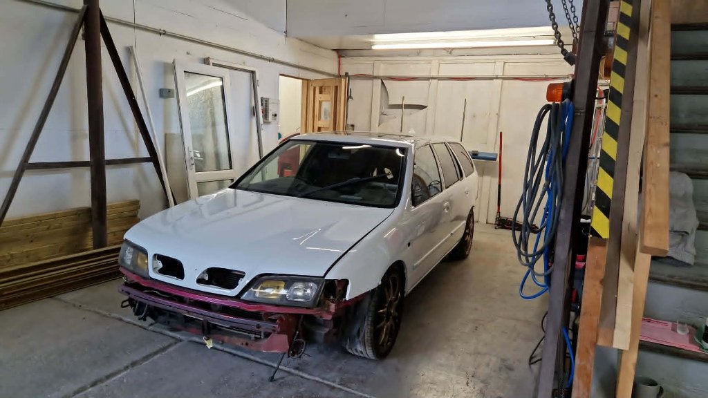 Jaguar XF full respray side profile in workshop — M&M Tewkesbury