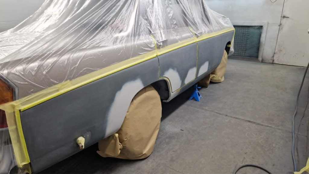 Classic car masked and primed in spray booth before respray — M&M Vehicle Repairs Tewkesbury